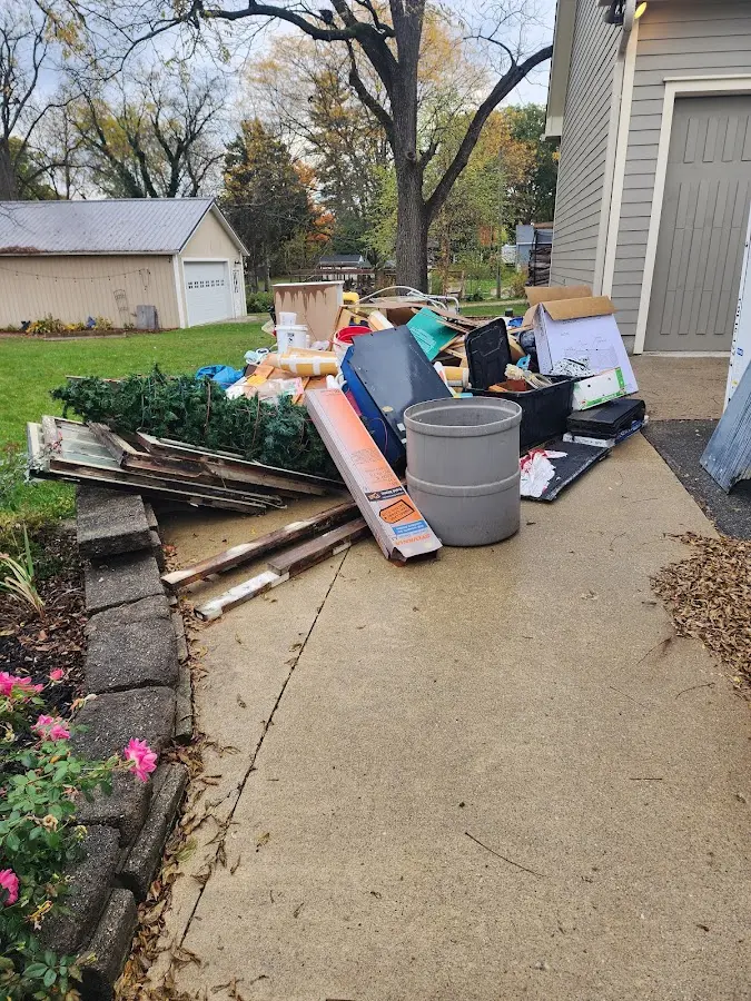 Dumpster being loaded with debris for Commercial Dumpster Rental in Scaggsville